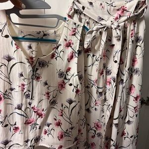 A blouse and skirt set.  The blouse size M  and skirt size L